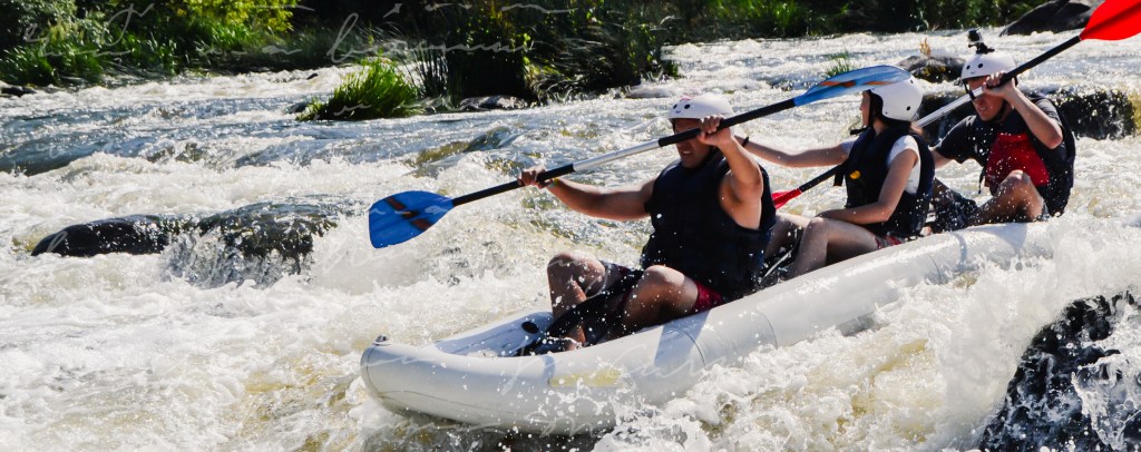 People white water rafting